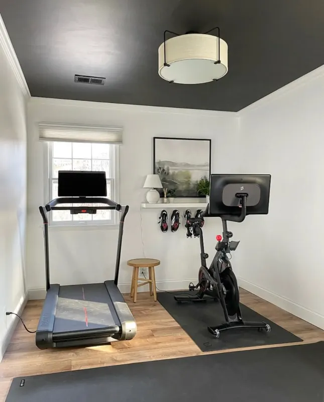 Spare bedroom home gym with a treadmill, from Sima Spaces